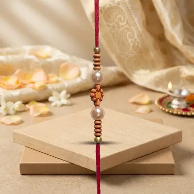 Traditional Red Thread Rakhi with Pearl Beads
