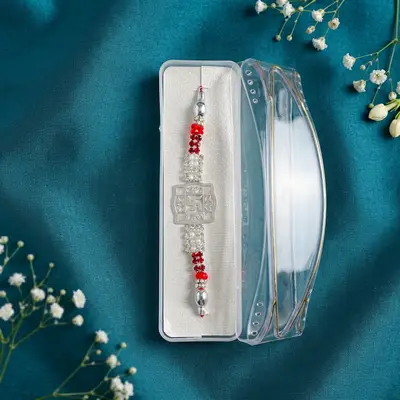 Silver Swastika Rakhi with Red and White Stones