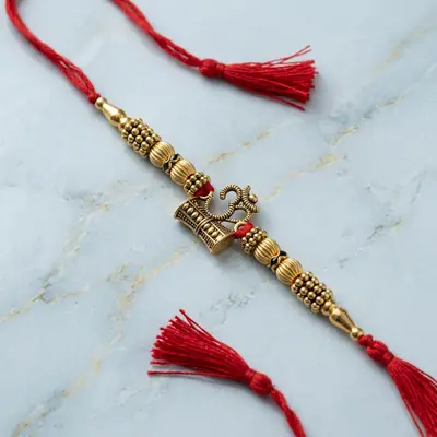 Manikanta Sai Om Trishul Gold Beaded Rakhi